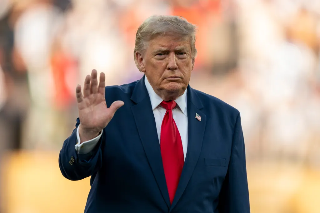 President Donald Trump waves to the crowd following Spain’s victory over Argentina during the FIFA World Cup 2026 final.