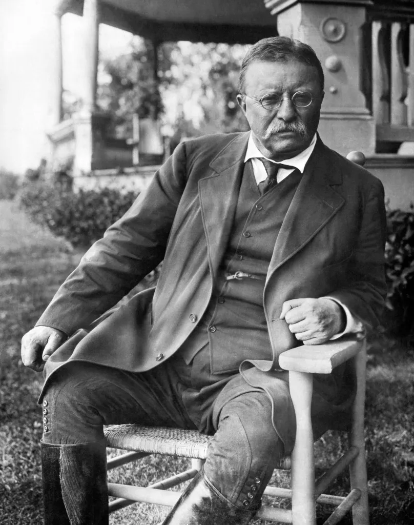 President Theodore Roosevelt seated in a chair outside his Sagamore Hill home on Long Island, Cove Neck, New York, circa 1907.