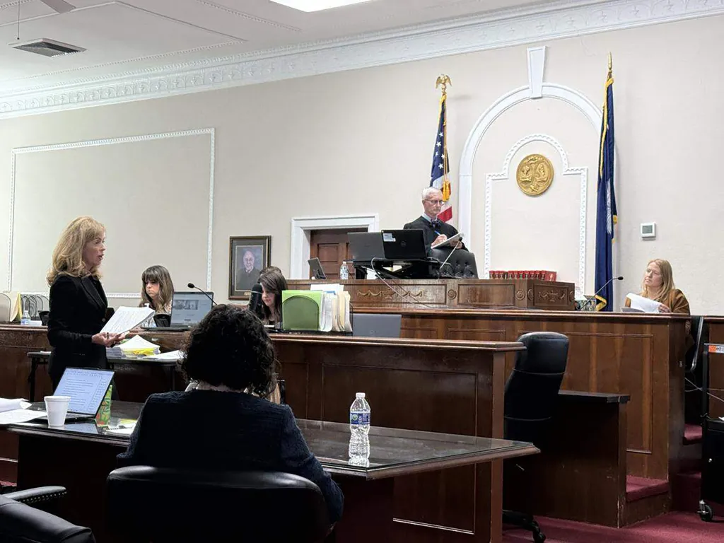 Deborah Barbier questioning podcaster Mandy Matney in court, with Judge R. Keith Kelly presiding.