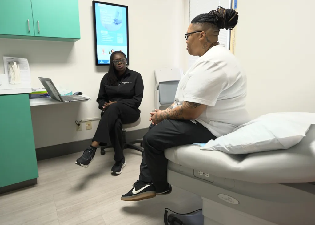 Rashan Williams, 41, of St. Petersburg, FL, speaking with an urogynecology specialist about her condition.