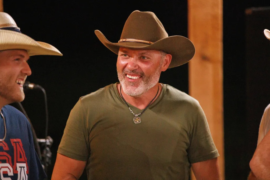 Steve McBee smiling while wearing a cowboy hat.