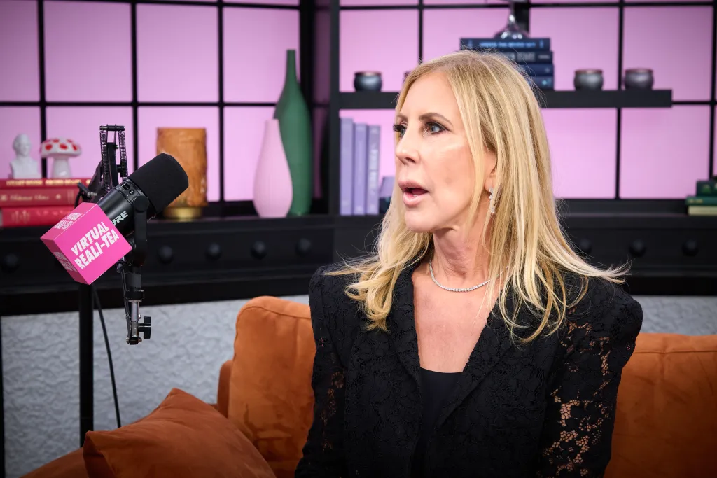 Vicki Gunvalson from Real Housewives sits on a brown couch during an interview at Page Six studio.