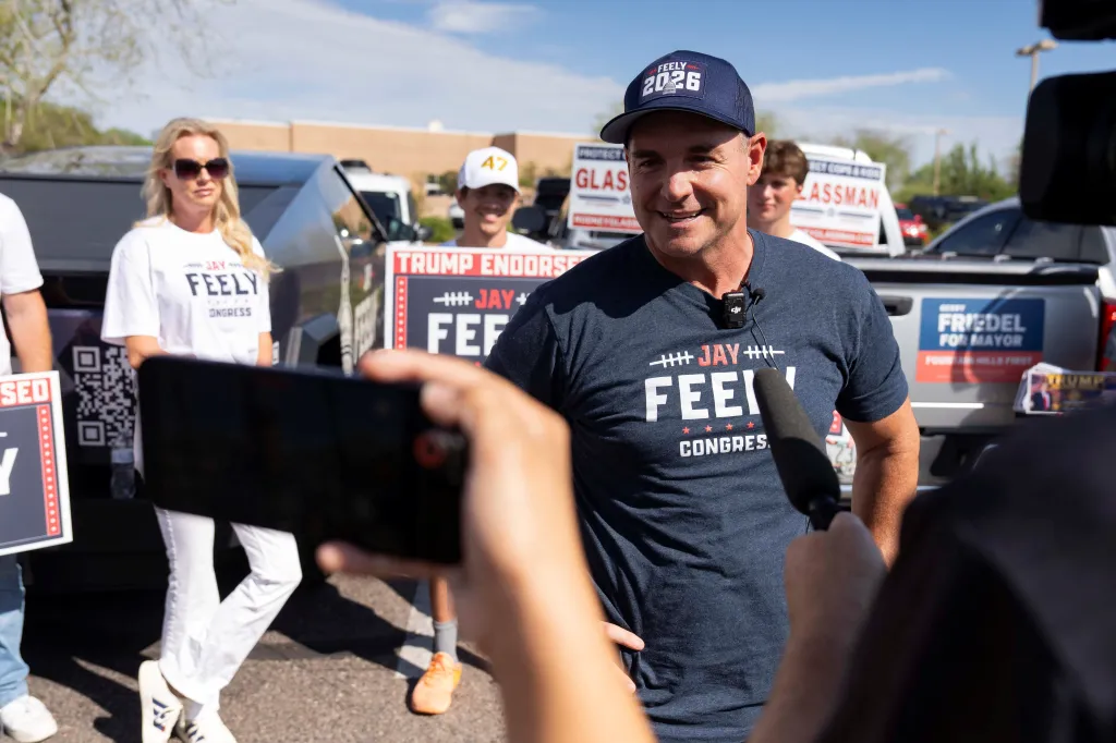 Jay Feely, Republican candidate for U.S. Congress, being interviewed at a polling location during Arizona's primary election.
