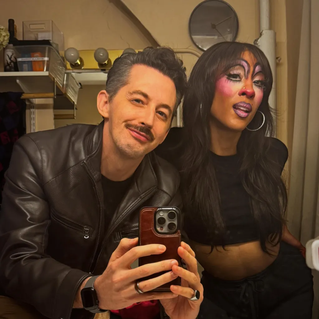 Mark and Angel reunited, taking a selfie together.