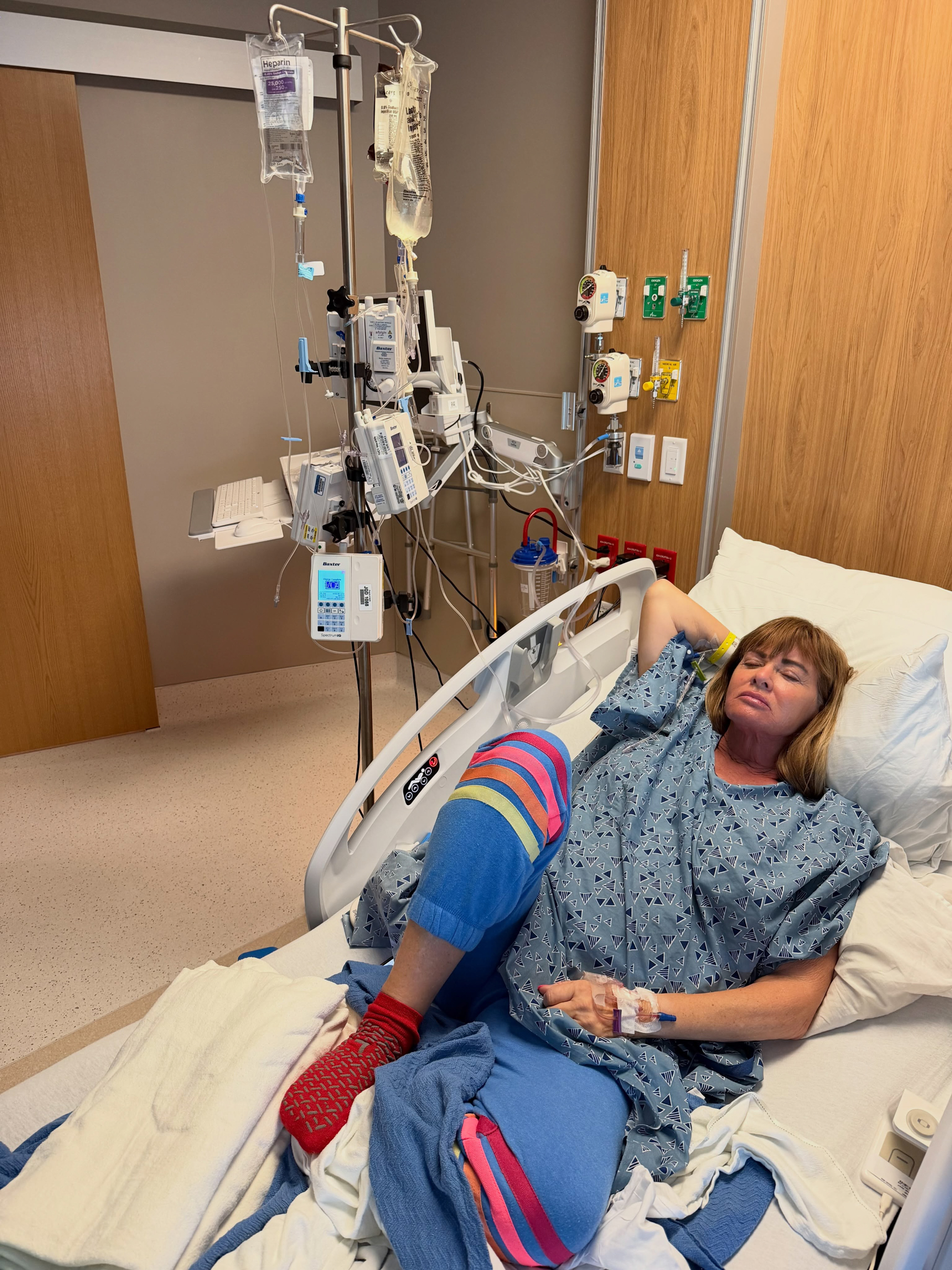 Jeana Keough lies in a hospital bed with IV drips attached.