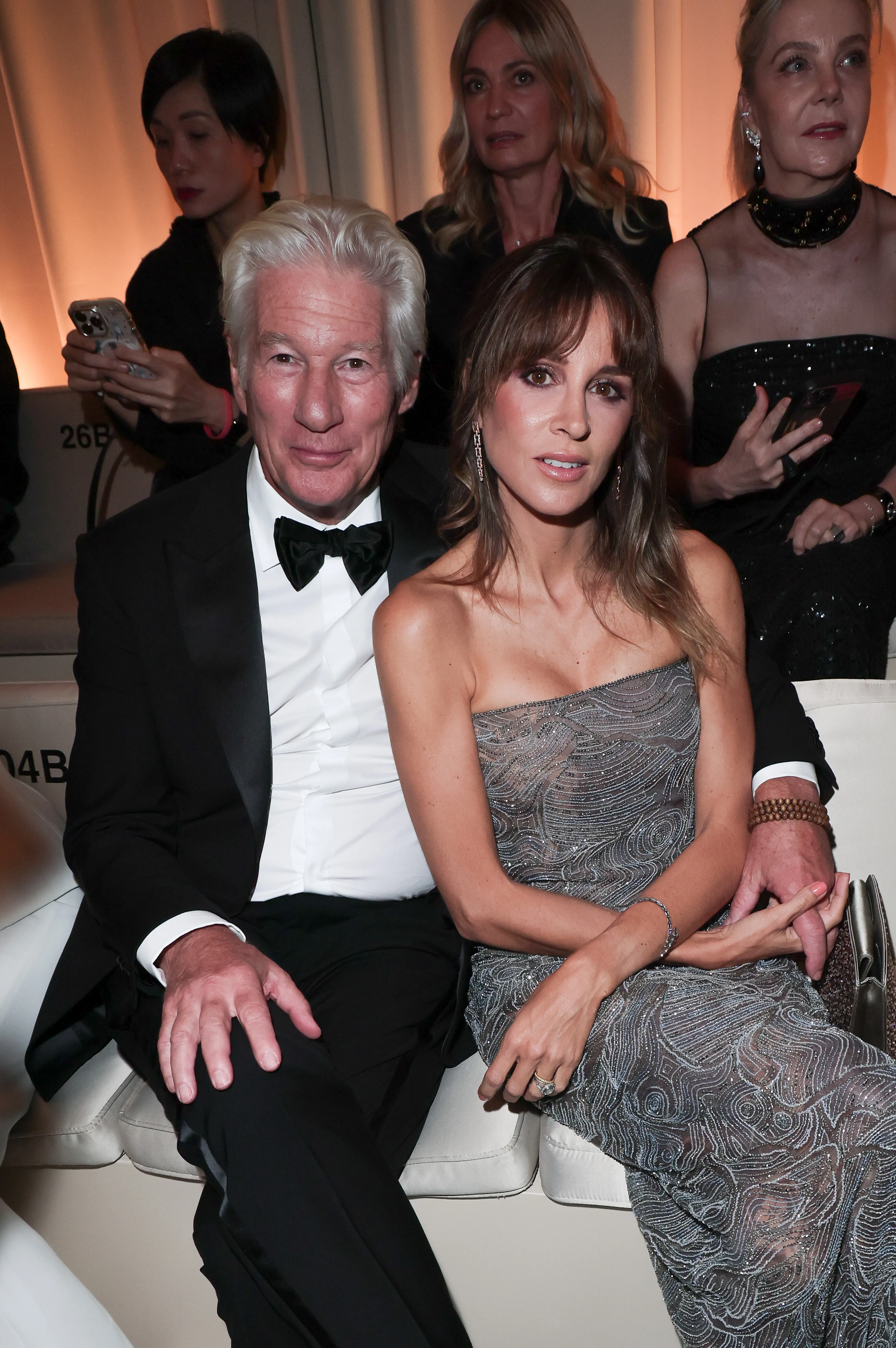 Richard Gere and Alejandra Silva at the Giorgio Armani fashion show.