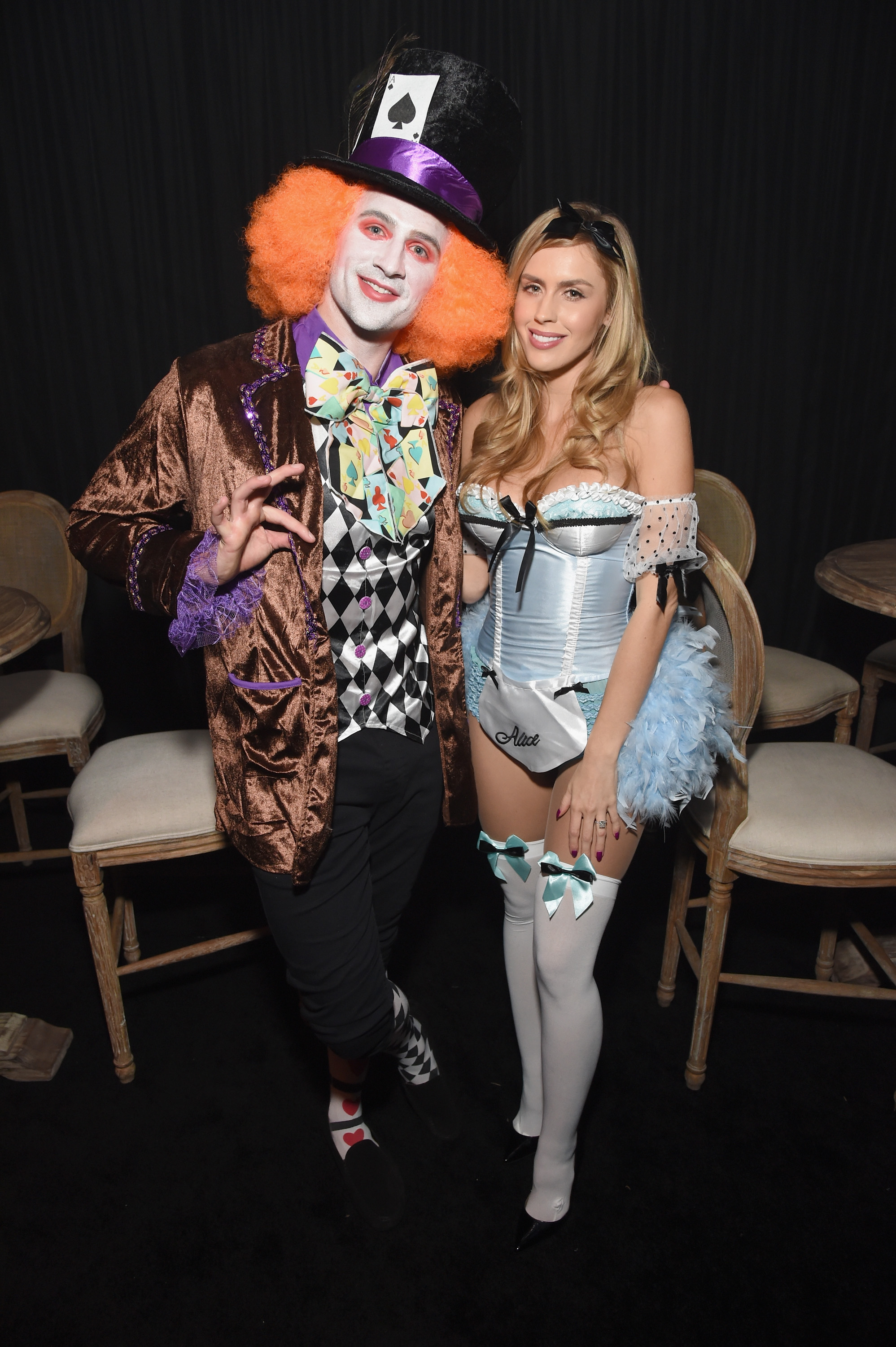 Ryan Lochte as the Mad Hatter and Kayla Rae Reid as Alice at a Halloween party.