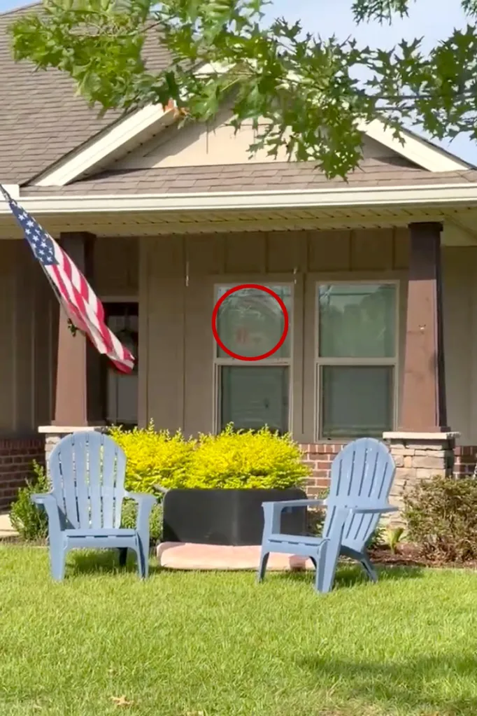 Red circle drawn around what appeared to be blood splatters on the window of a house.