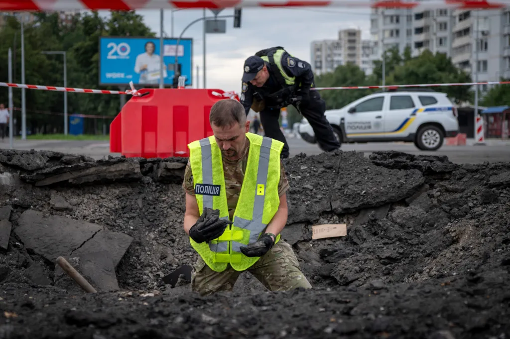 A sapper examining the impact site of a Russian missile in Kyiv.