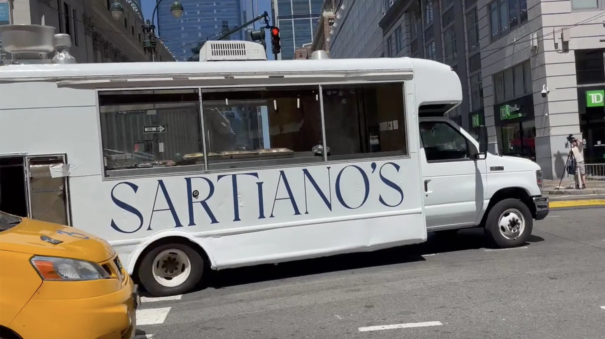 Sartiano's restaurant truck parked on a city street.