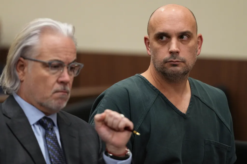 Sean M. Higgins, right, and his lawyer Matthew Portella, in court.