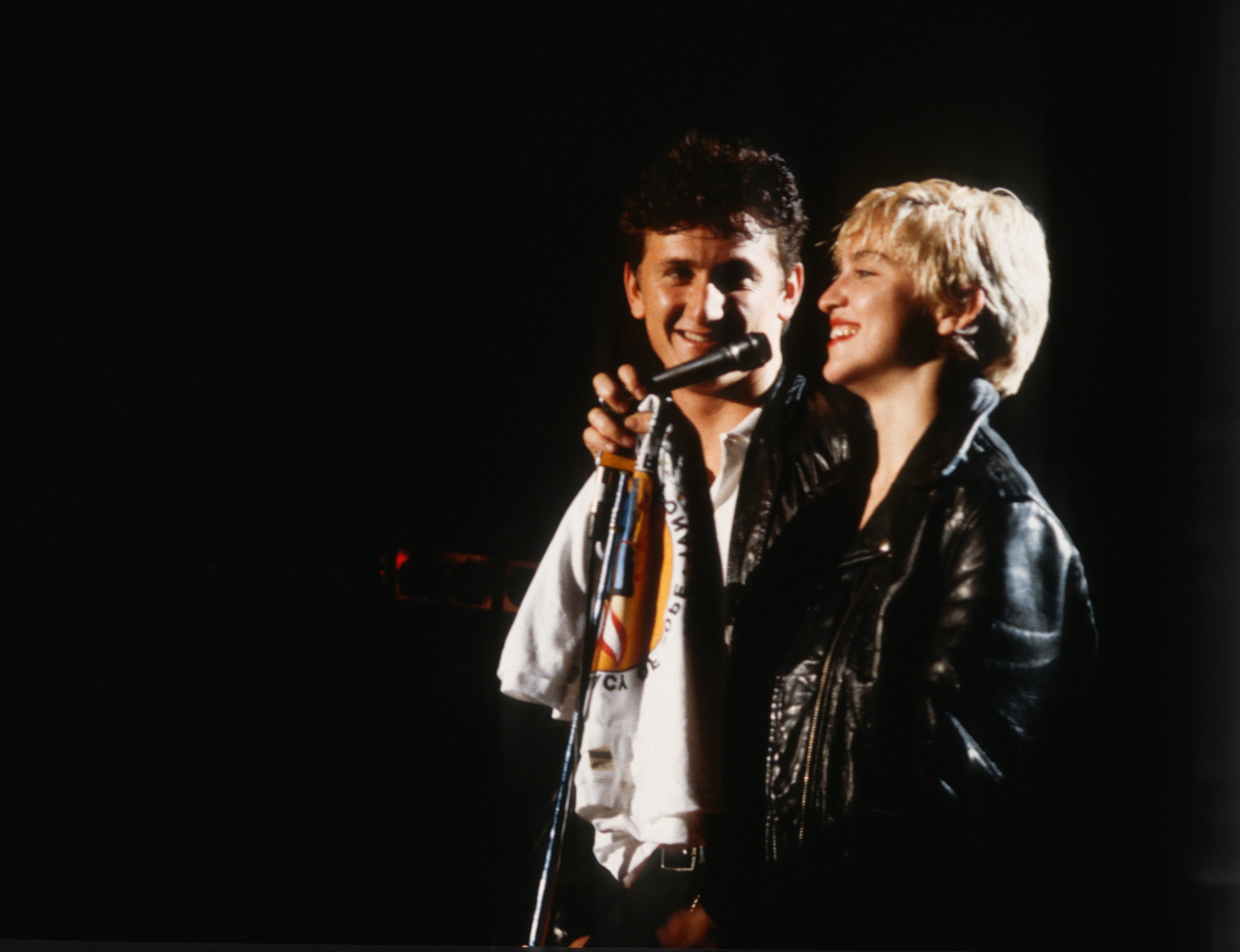 Sean Penn and Madonna perform onstage.