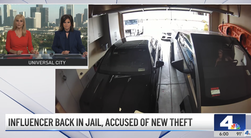 News report showing two anchors and security camera footage of a woman inside a Tesla in a garage.