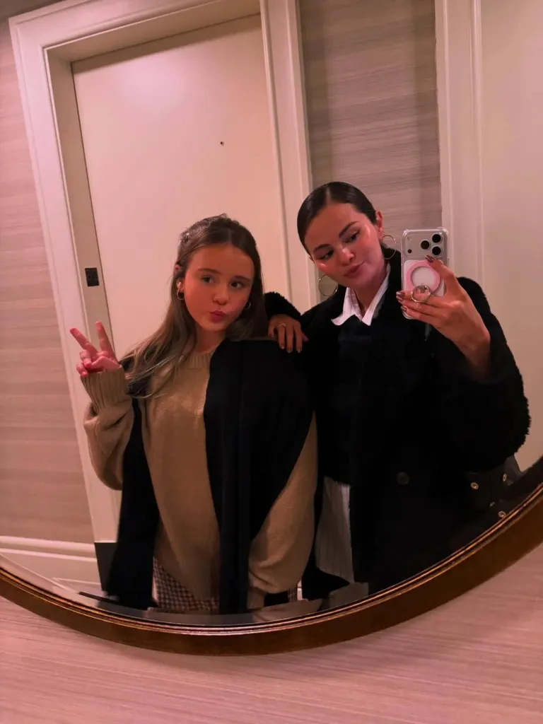 Selena Gomez taking a mirror selfie with her younger sister Gracie Elliott Teefey.