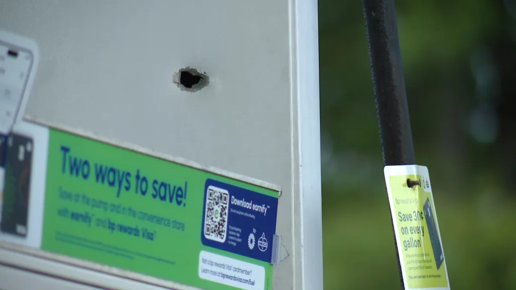 Bullet hole in a gas pump.
