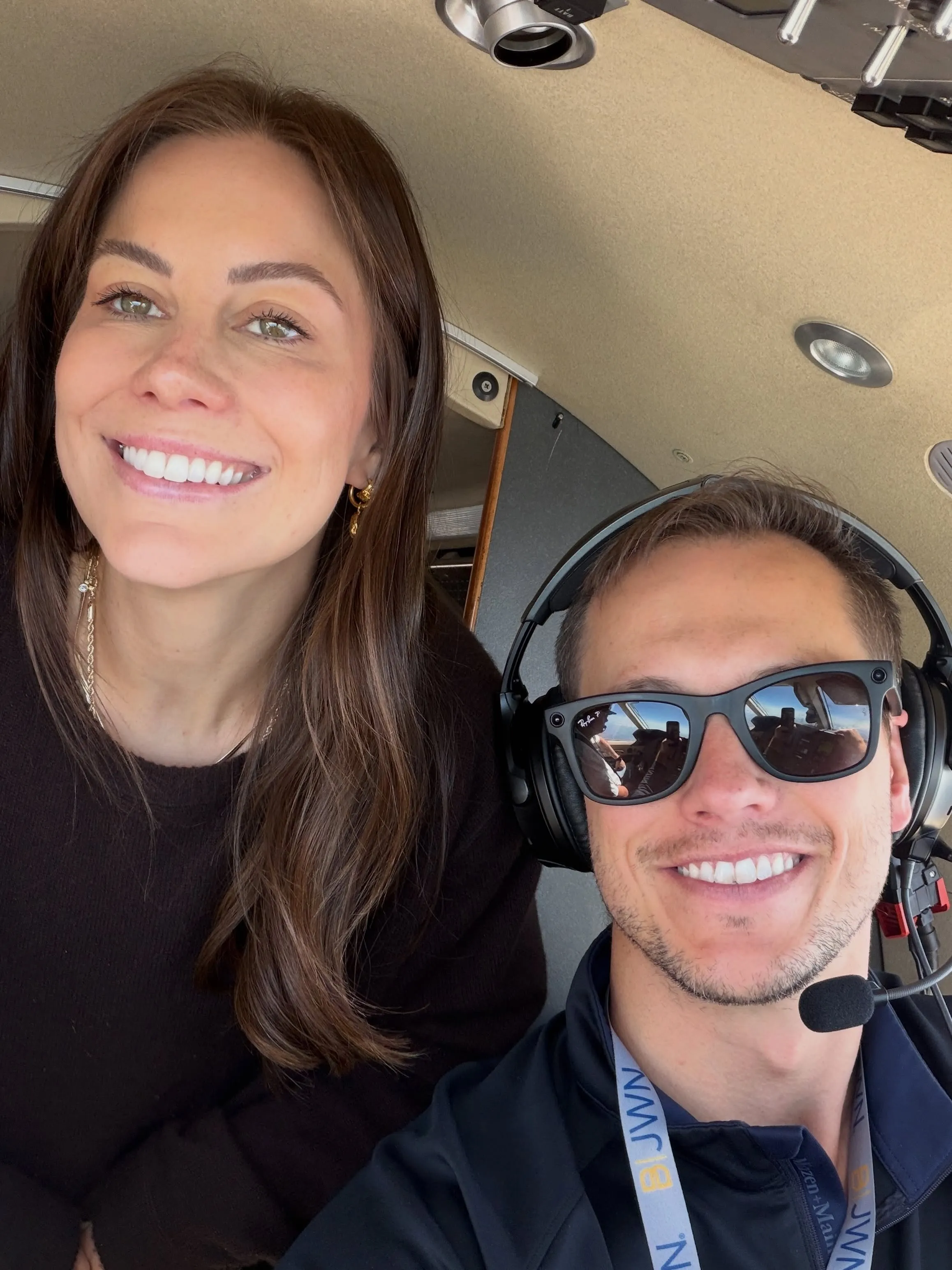 Shawn Johnson and Andrew East taking a selfie in a small plane.