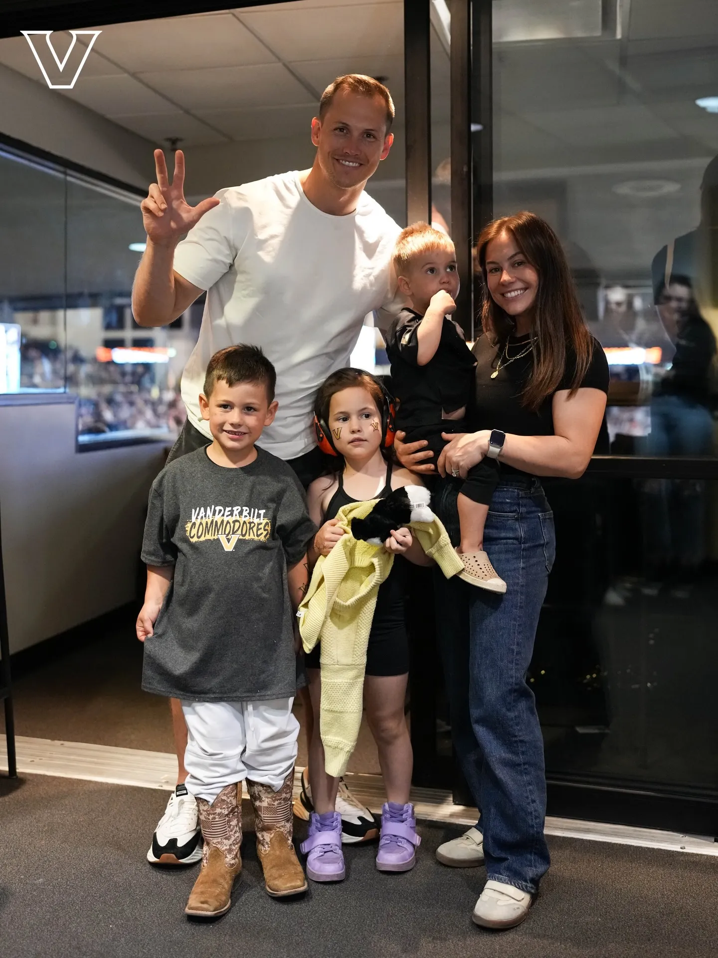 Shawn Johnson and Andrew East with their three children.
