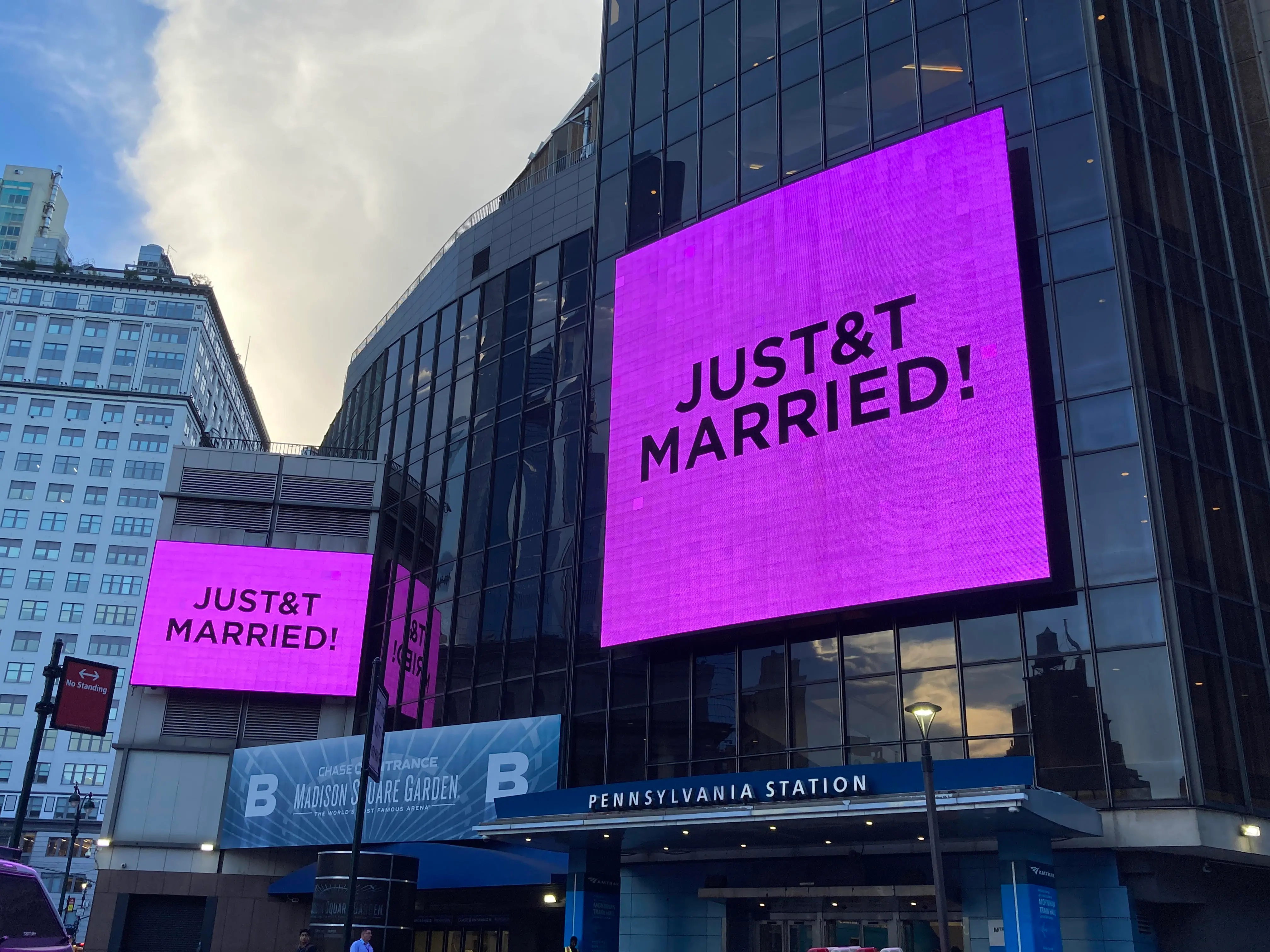 Signs reading "JUST & T MARRIED!" illuminate outside Madison Square Garden and Pennsylvania Station.