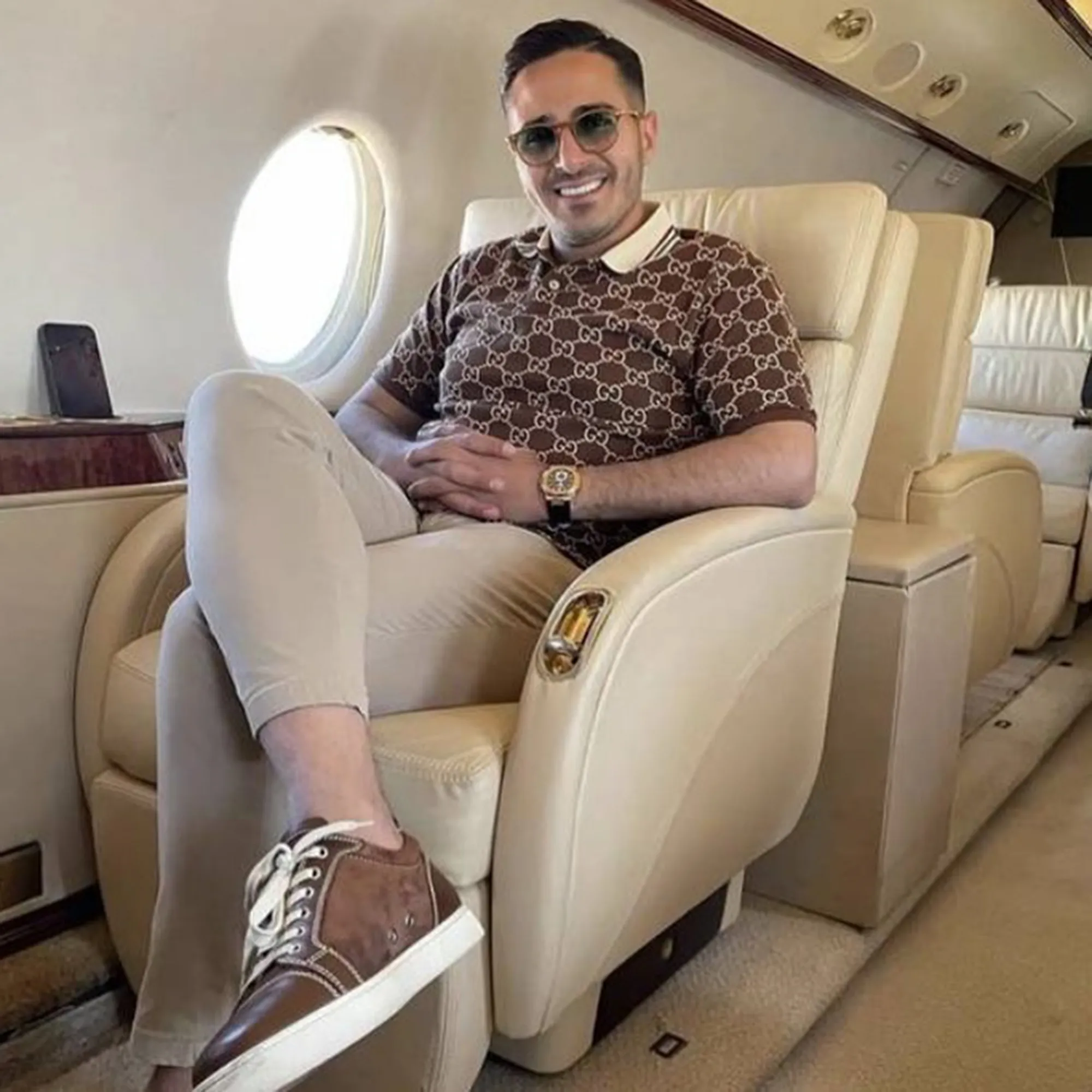 Simon Leviev smiling in a private jet.