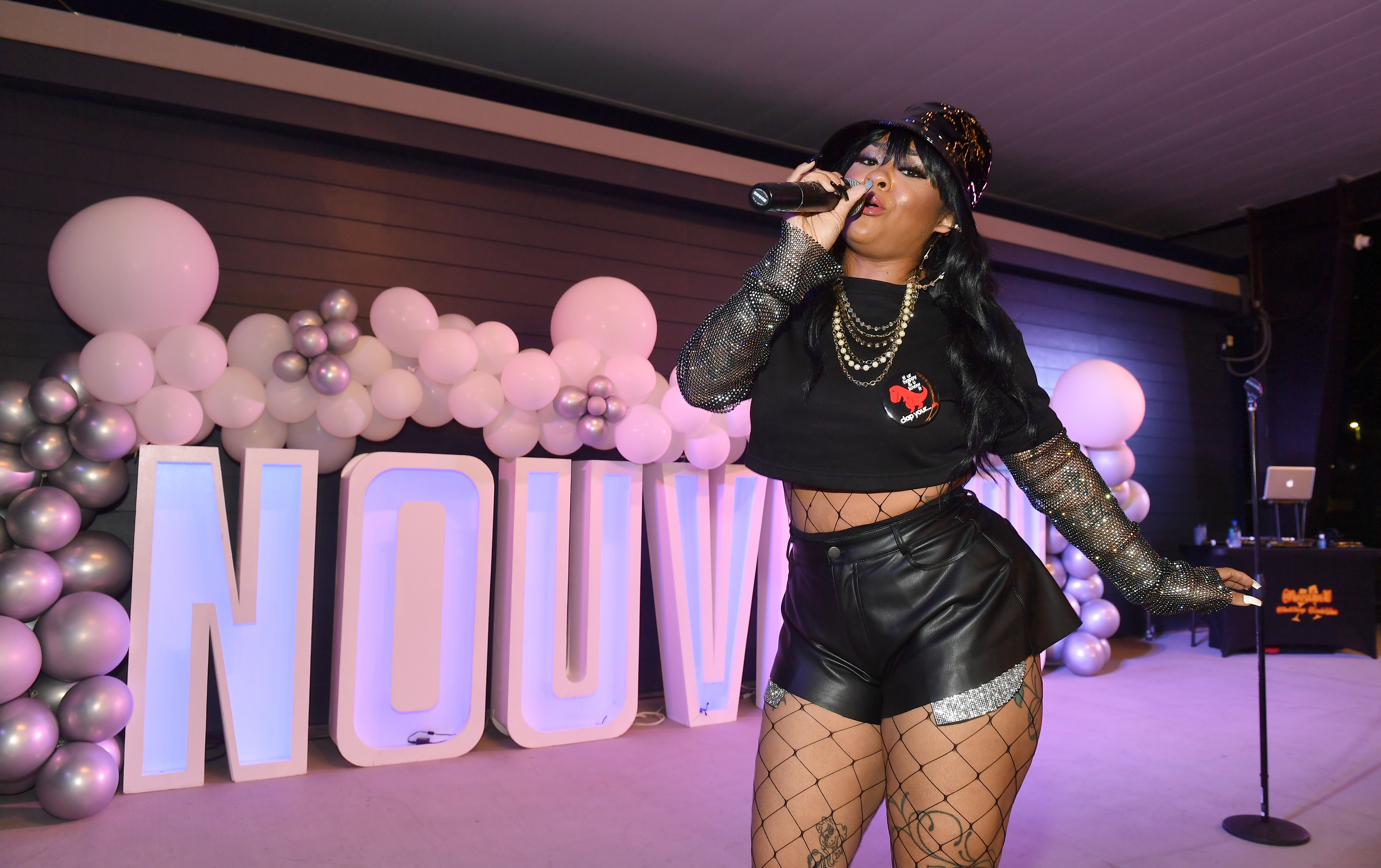 Singer Nivea performs onstage during Nouveau Bar & Grill Celebrity Grand Opening.