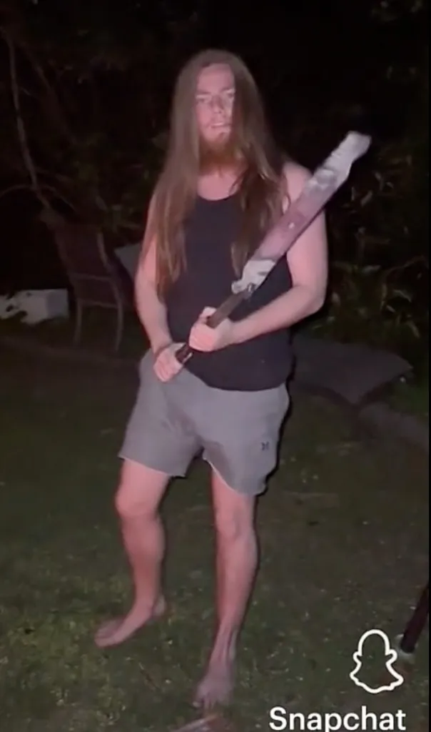 Chester Green holding a machete.