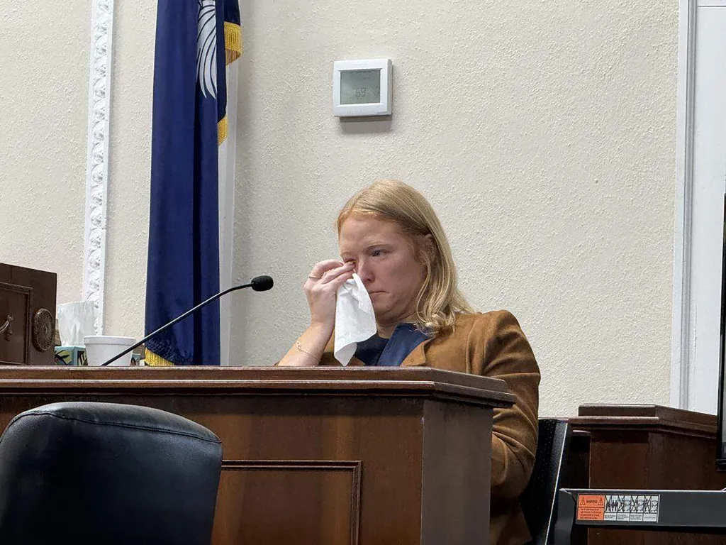 South Carolina crime podcaster Mandy Matney wipes away tears during questioning at a court hearing.