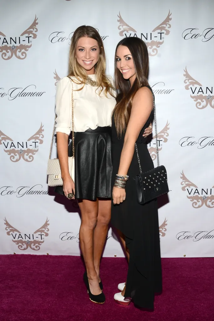 Stassi Schroeder and Scheana Marie posing together on a magenta carpet.