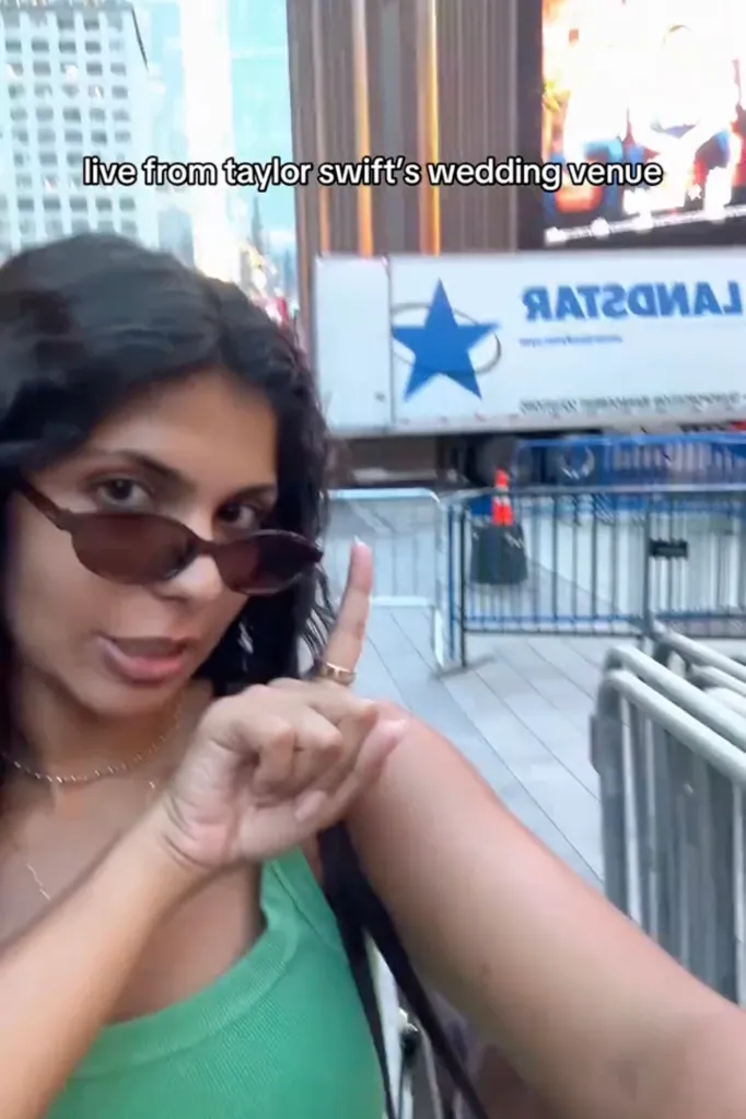 A woman in sunglasses points with her right index finger, with text 