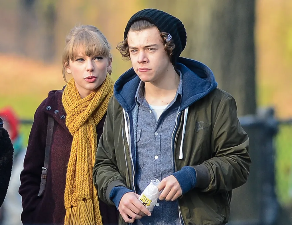 Taylor Swift and Harry Styles walking outdoors in New York City.