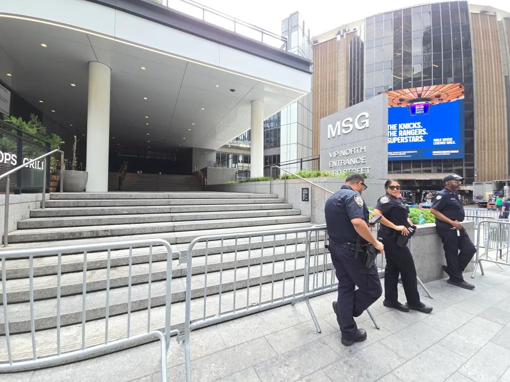 Security personnel standing near the VIP North Entrance of Madison Square Garden.