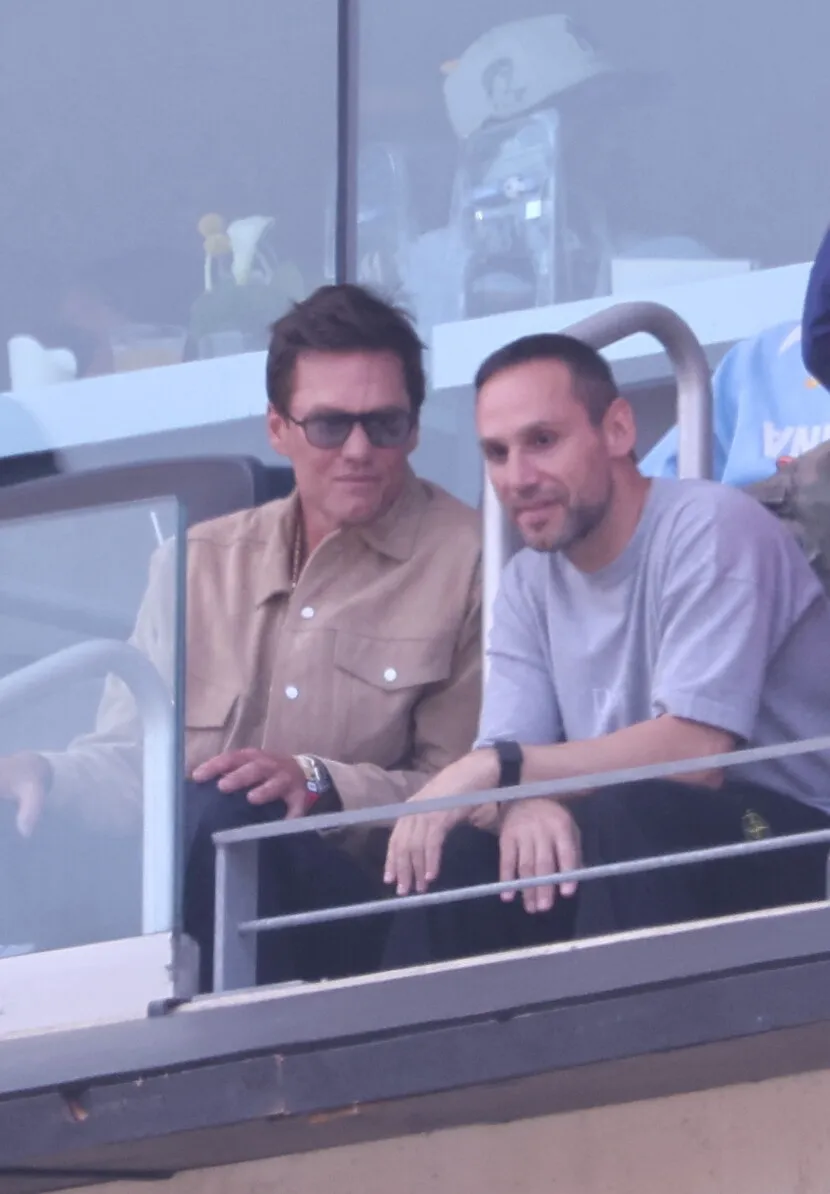Tom Brady in sunglasses, watching the 2026 World Cup Final from the stands.