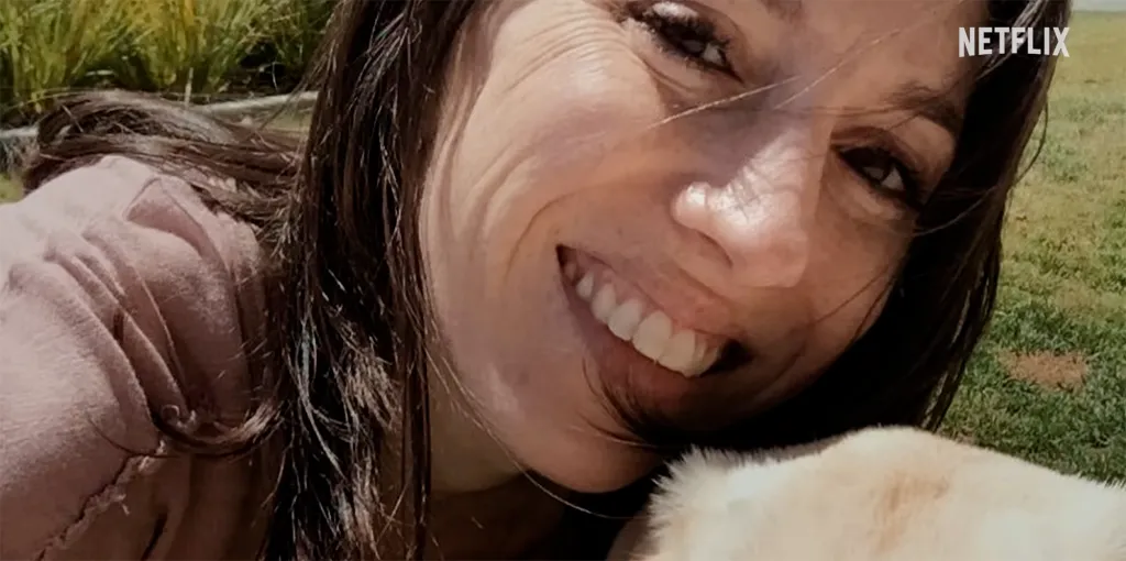 A smiling woman with dark hair and a light pink shirt, with the Netflix logo in the top right.