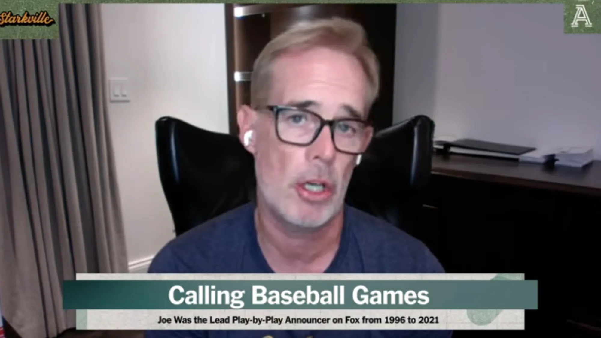 A man with glasses and earbuds discusses calling baseball games as the former lead play-by-play announcer for Fox.