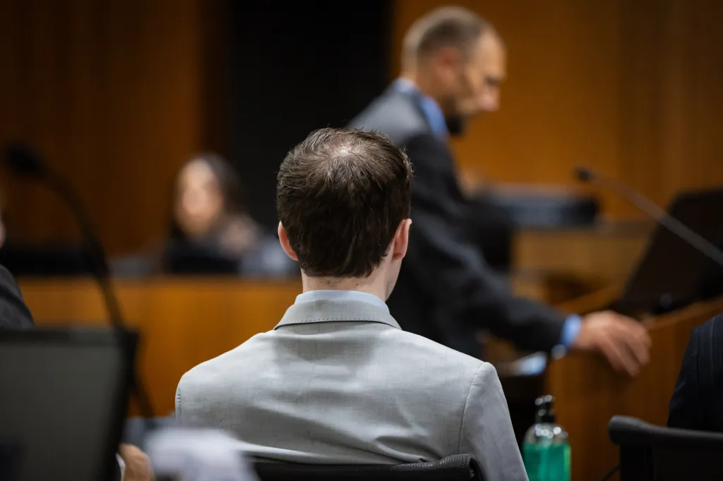 Tyler Robinson listens during a preliminary hearing.