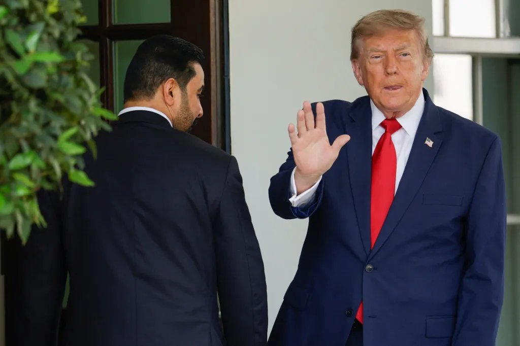 Donald Trump gesturing with an open palm as he greets Iraqi Prime Minister Ali al-Zaidi at the White House on July 14, 2026.