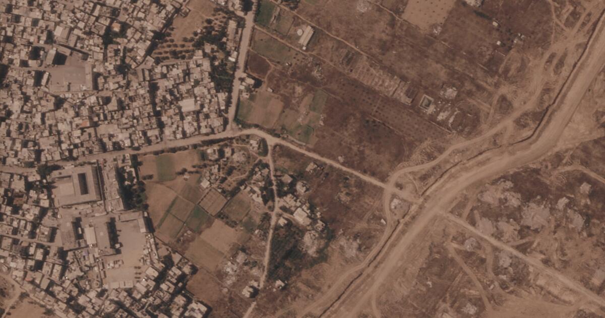 Israel is building a miles-long earthen barrier inside Gaza, entrenching its division