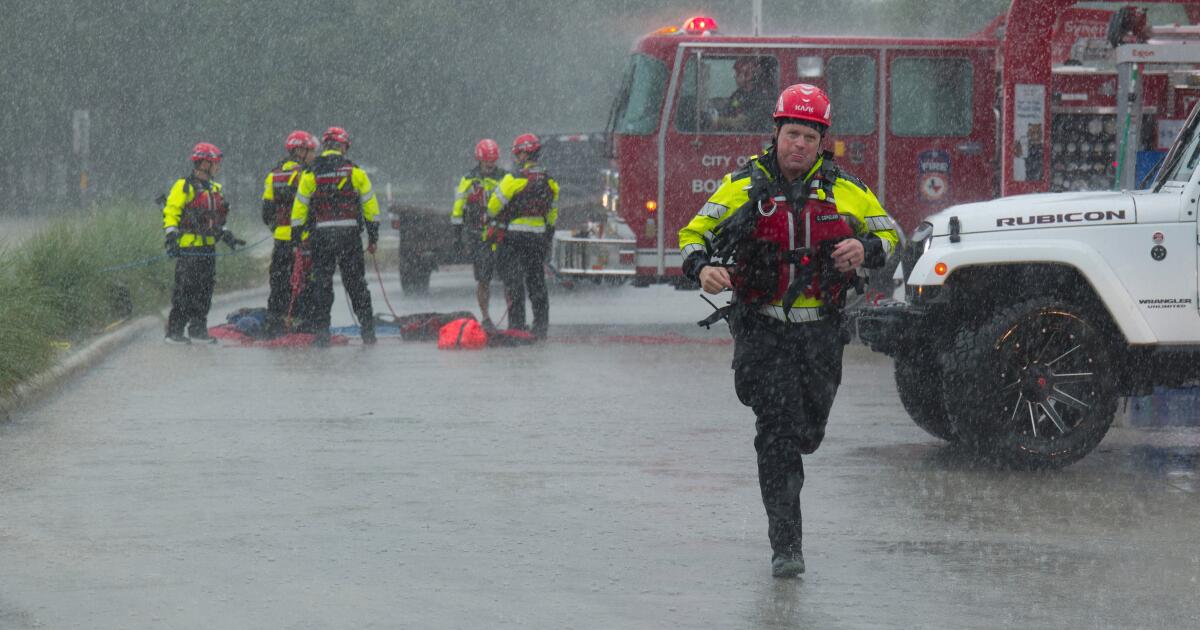 Texas flooding surges from huge rainstorms as rescuers pull people from rising waters