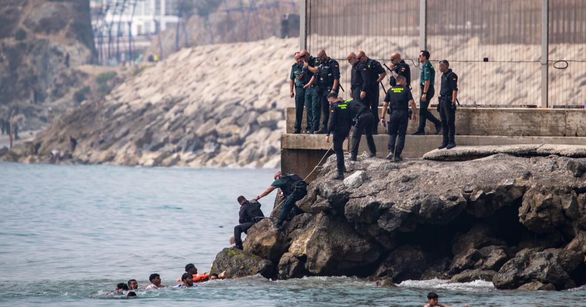 Thousands of people break through border separating Morocco from Spain’s Ceuta