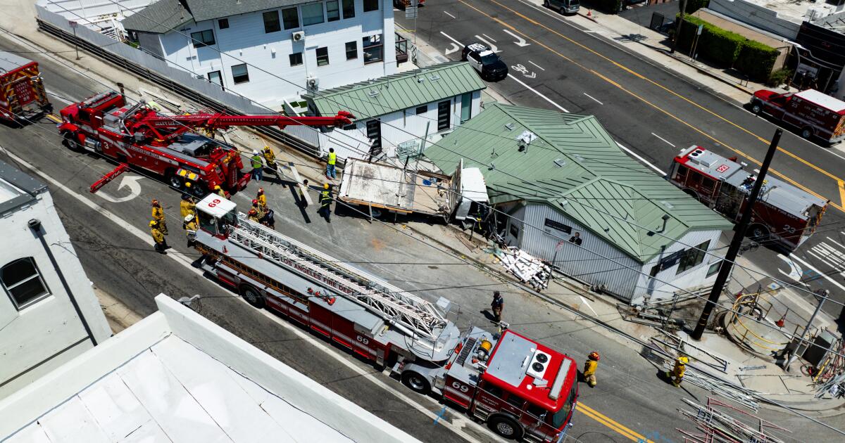 Fire crews rescue man trapped in truck that crashed into a Pacific Palisades building