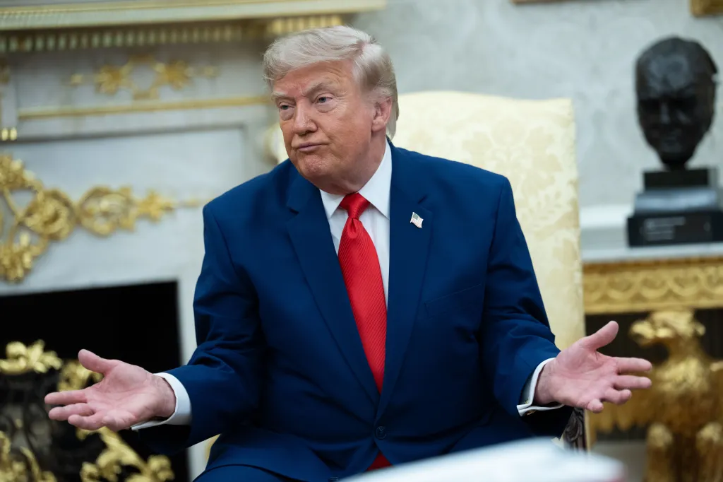 Donald Trump speaking at a meeting in the Oval Office.