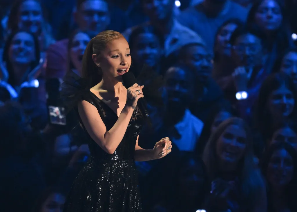 Ariana Grande speaks on stage at the MTV Video Music Awards.