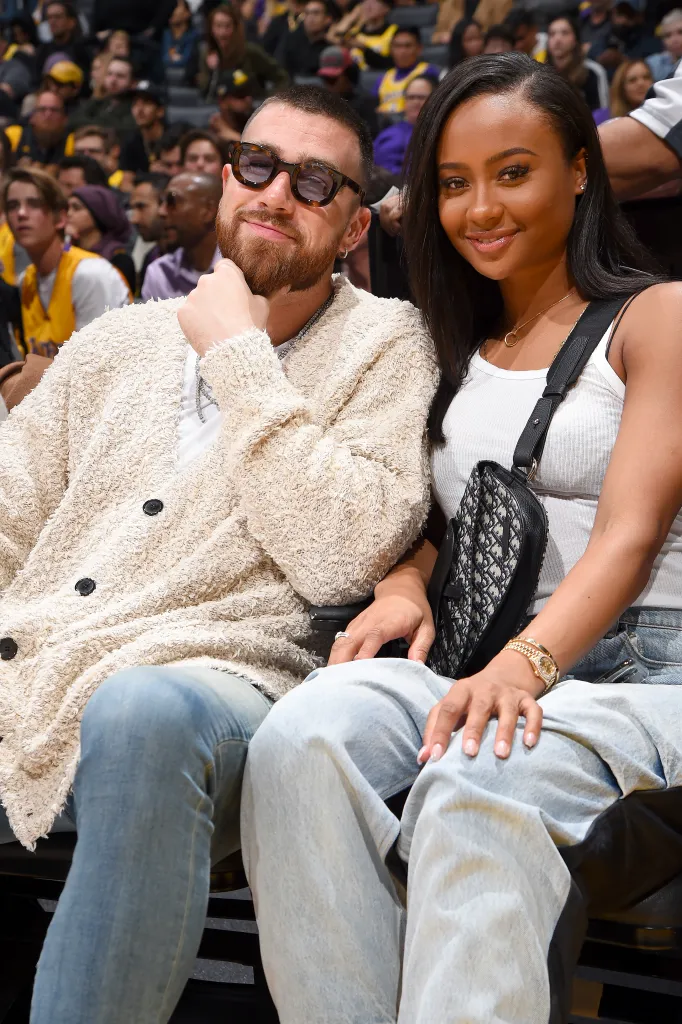 Travis Kelce and Kayla Nicole posing for a photo.
