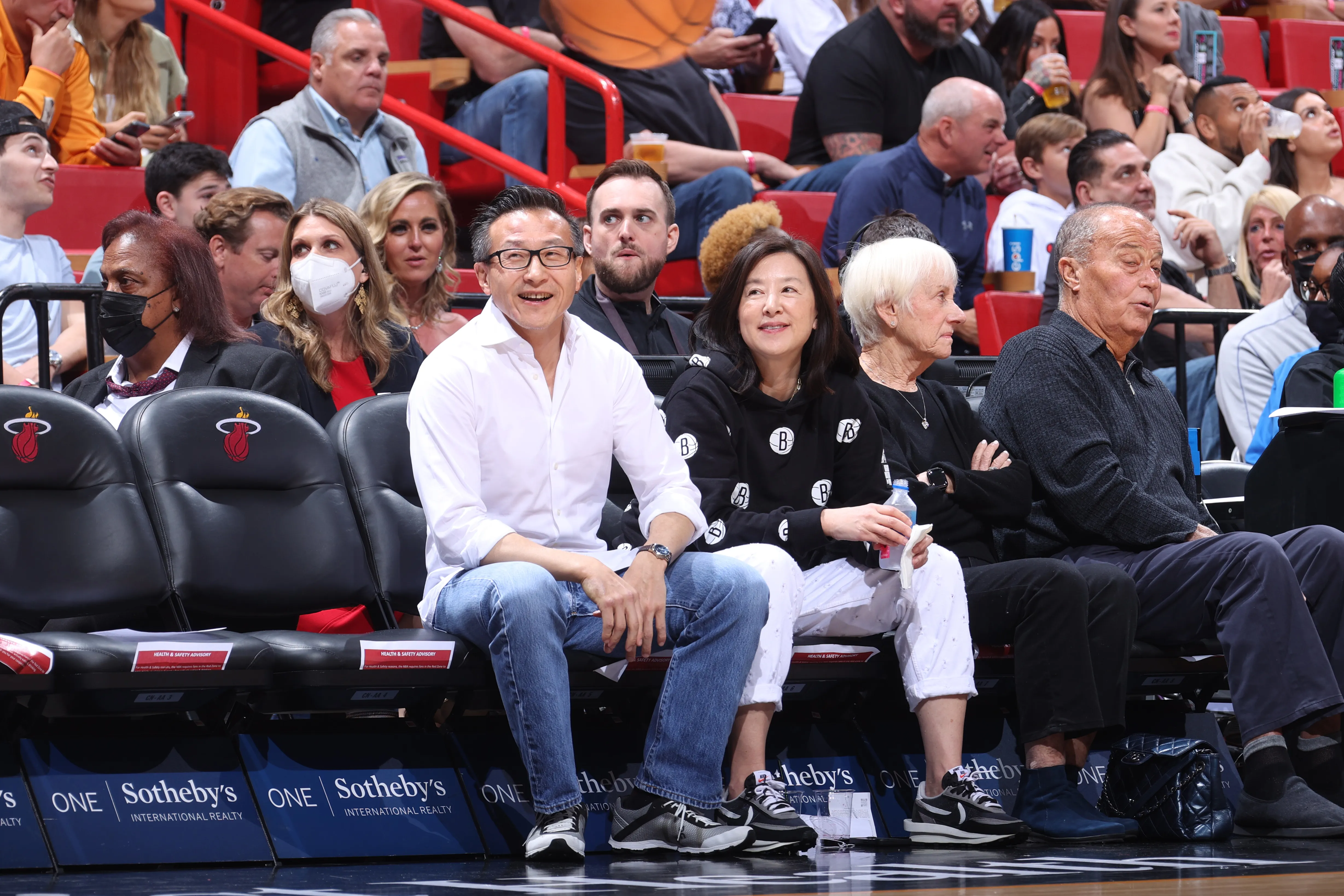 Owner Joseph C. Tsai and Clara Wu Tsai of the Brooklyn Nets sitting courtside at a game.