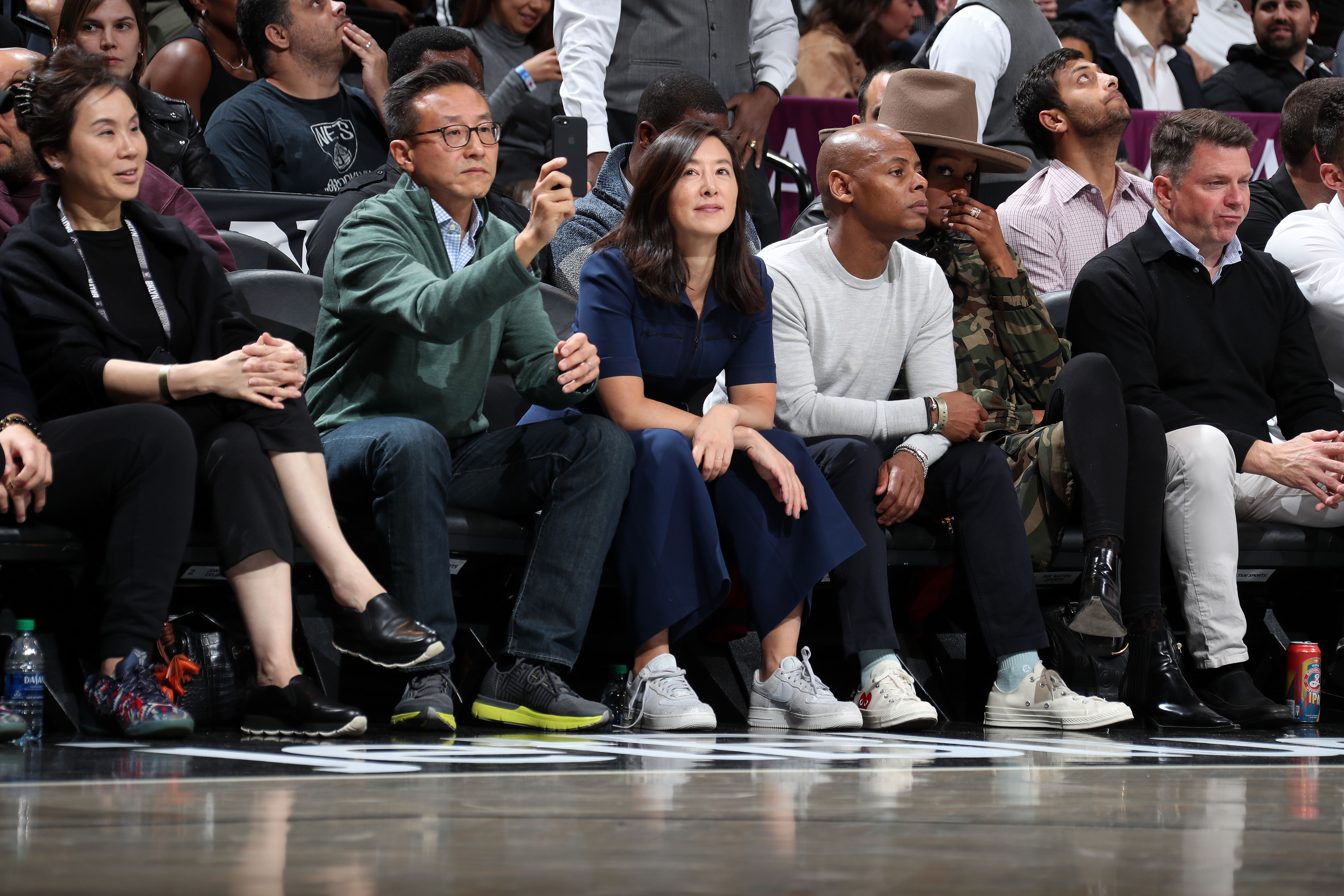 Andy Shay and Joe Tsai attending a basketball game.