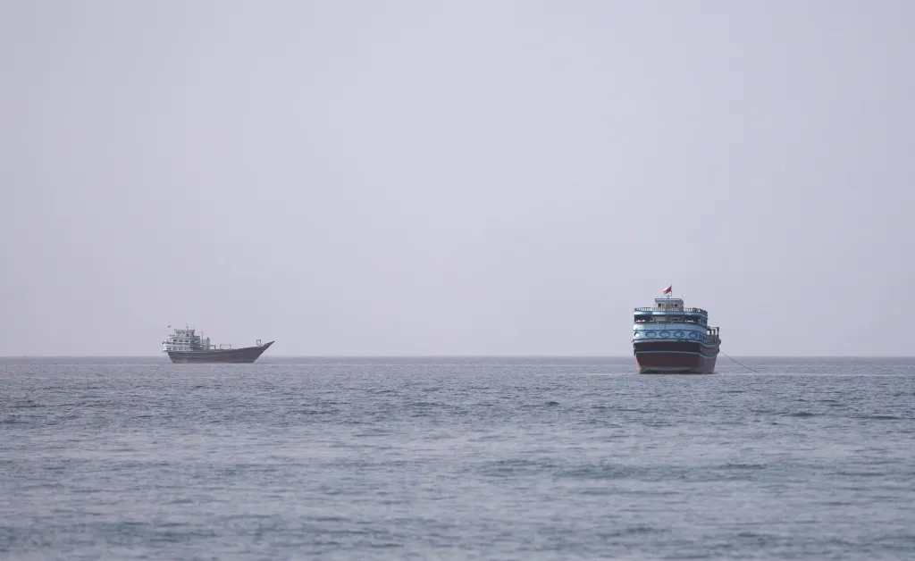 Two vessels at the Strait of Hormuz, seen from Musandam.