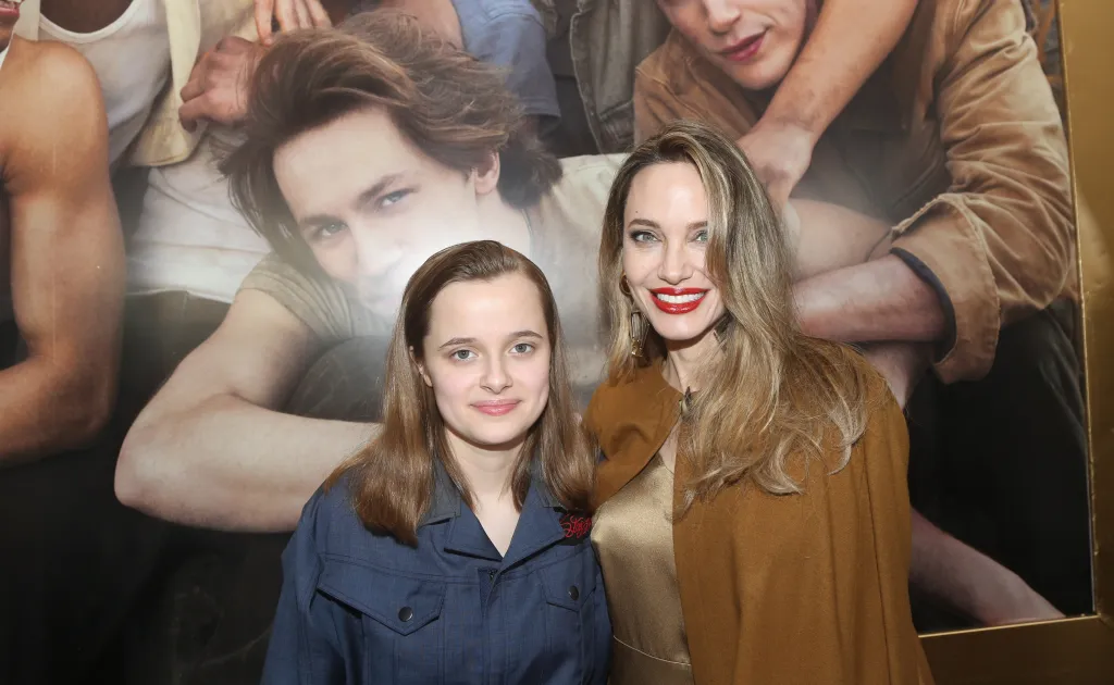 Vivienne Jolie-Pitt and Angelina Jolie pose together at the opening night of "The Outsiders" at The Bernard B. Jacobs Theatre.