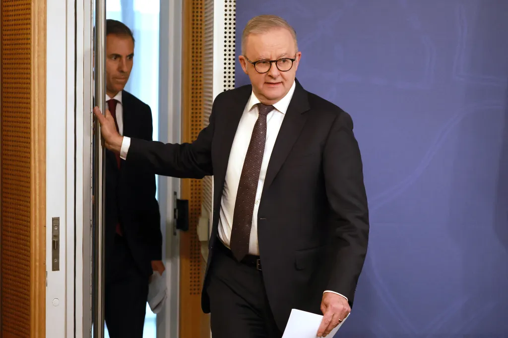 Australia's Prime Minister Anthony Albanese and Treasurer Jim Chalmers walk to a press conference.