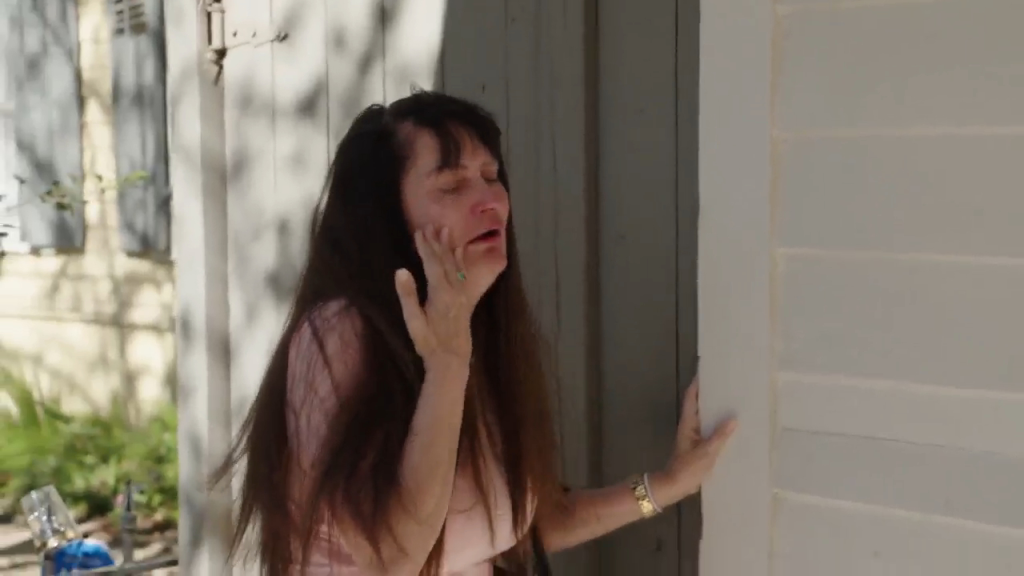 Debby collapsing in distress at a wedding chapel.