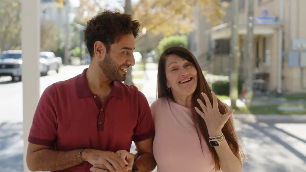 Mido and Debby from 90 Day Fiance walking together and smiling.