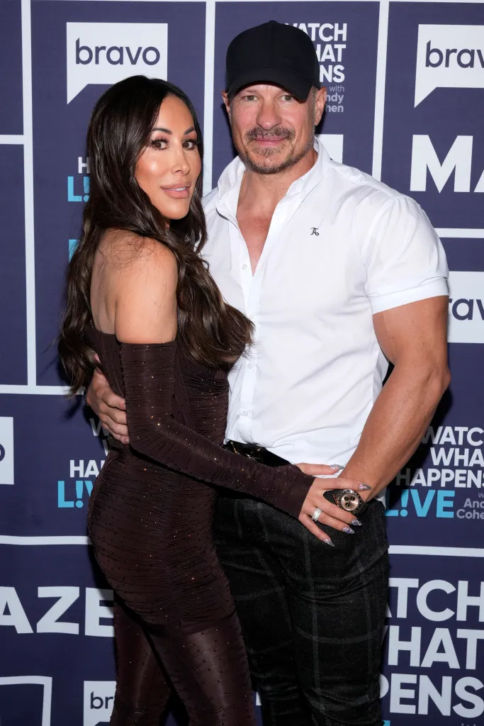 Angie Katsanevas and Shawn Trujillo posing together at Watch What Happens Live.
